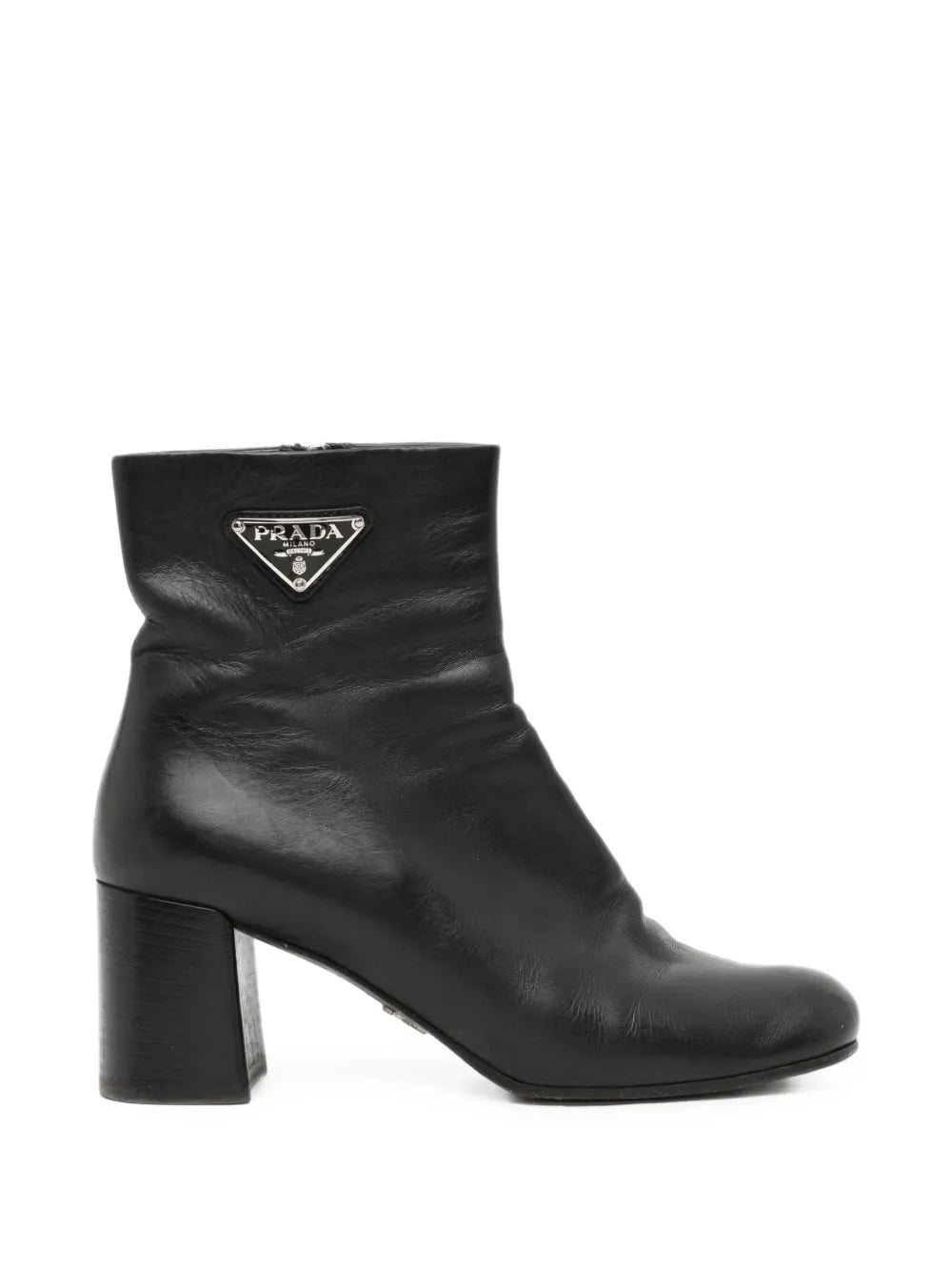 Black Prada ankle boots, stylish shoes with sleek design and pointed toe, made from smooth leather.