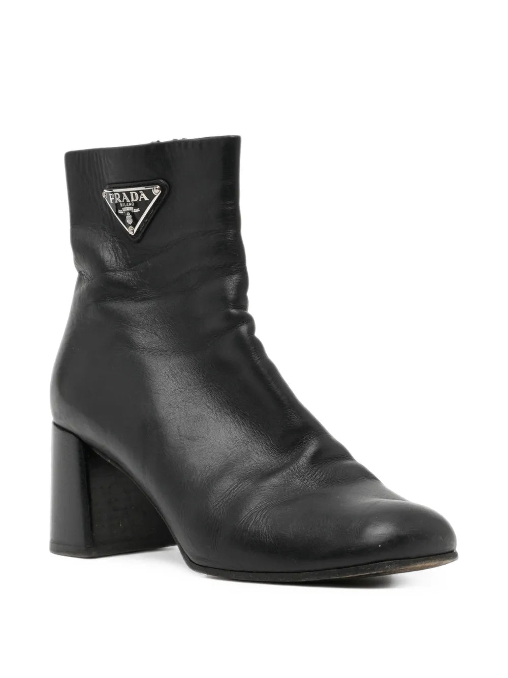 Black Prada ankle boots with sleek leather design and side zipper, featuring a stylish low heel and pointed toe.