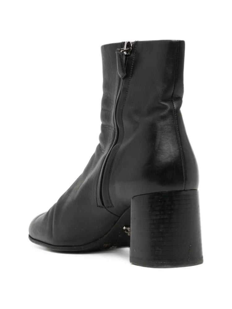 Black Prada ankle boots with sleek leather design and subtle heel, stylish shoes for versatile everyday wear.