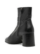Black Prada ankle boots with sleek leather design and subtle heel, stylish shoes for versatile everyday wear.