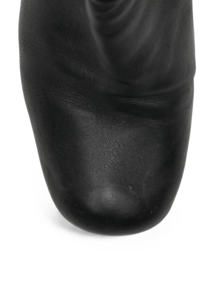 Black Prada ankle boots with sleek leather design and stylish low heels, perfect for casual or dressy outfits.