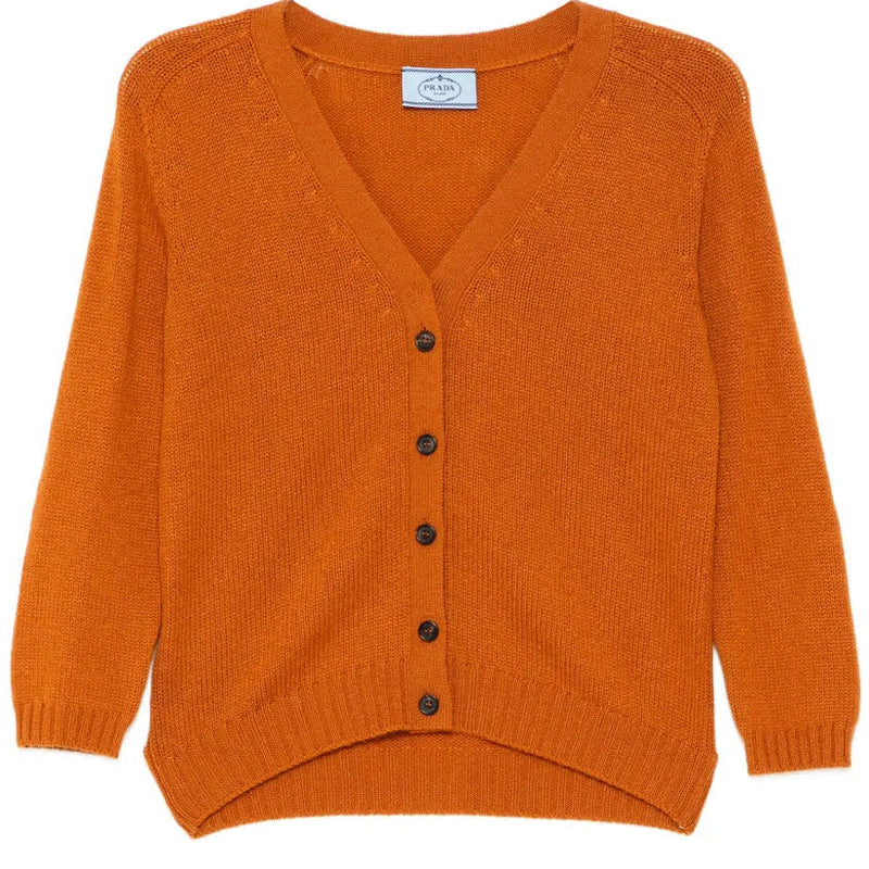 Prada burnt orange cashmere cardigan, soft and cozy tops with a classic knit texture, displayed on a neutral background.