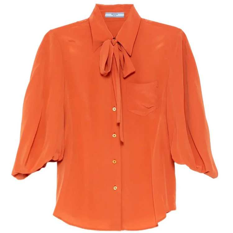 Prada coral silk shirt, stylish tops with smooth fabric and elegant design, displayed on a flat surface.