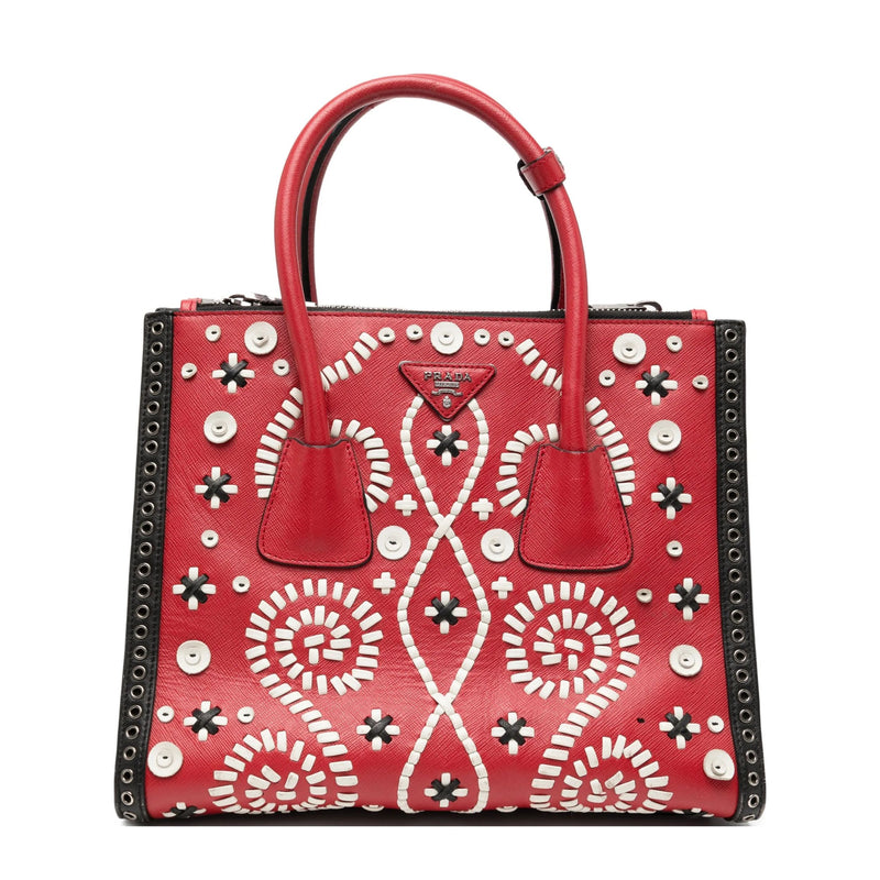 Prada embroidered Saffiano tote bag, front view showing twin pockets in brick red leather