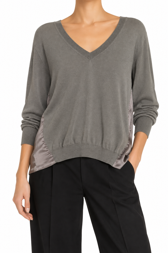Prada grey knit top, soft and cozy, featuring a classic crew neck and long sleeves, perfect for casual or stylish wear.