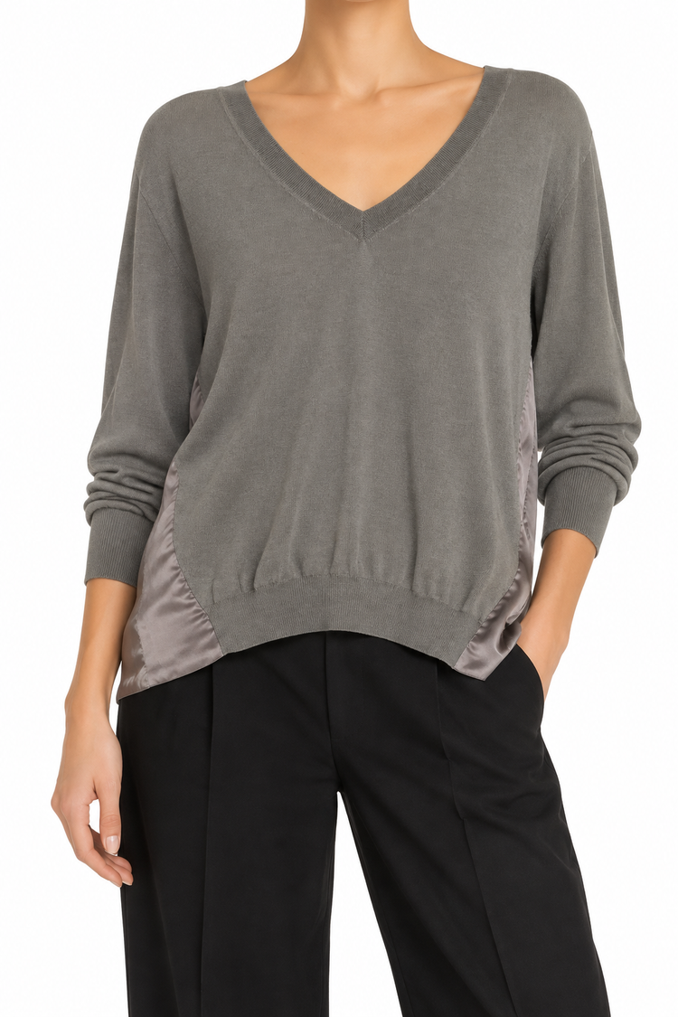 Prada grey knit top, soft and cozy, featuring a classic crew neck and long sleeves, perfect for casual or stylish wear.