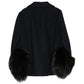 Navy Prada wool jacket with statement cuff, shown from the back, featuring tailored fit and stylish design.