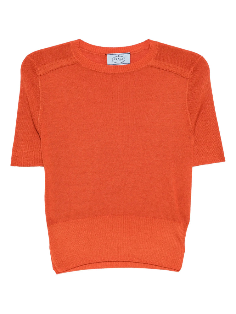 Prada orange knit top with long sleeves and ribbed texture, stylish and cozy for casual wear.