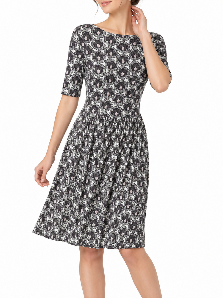 Prada printed silk gathered dress with floral pattern, elegant design, and flowing fabric, perfect for stylish occasions.