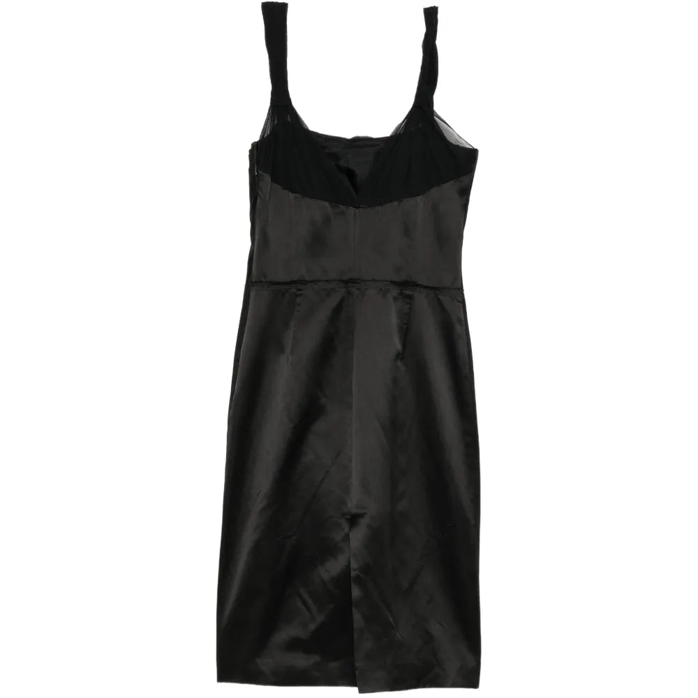 Elegant Prada structured bodice dress with fitted waist and sleek design, showcased in a sophisticated fashion image.