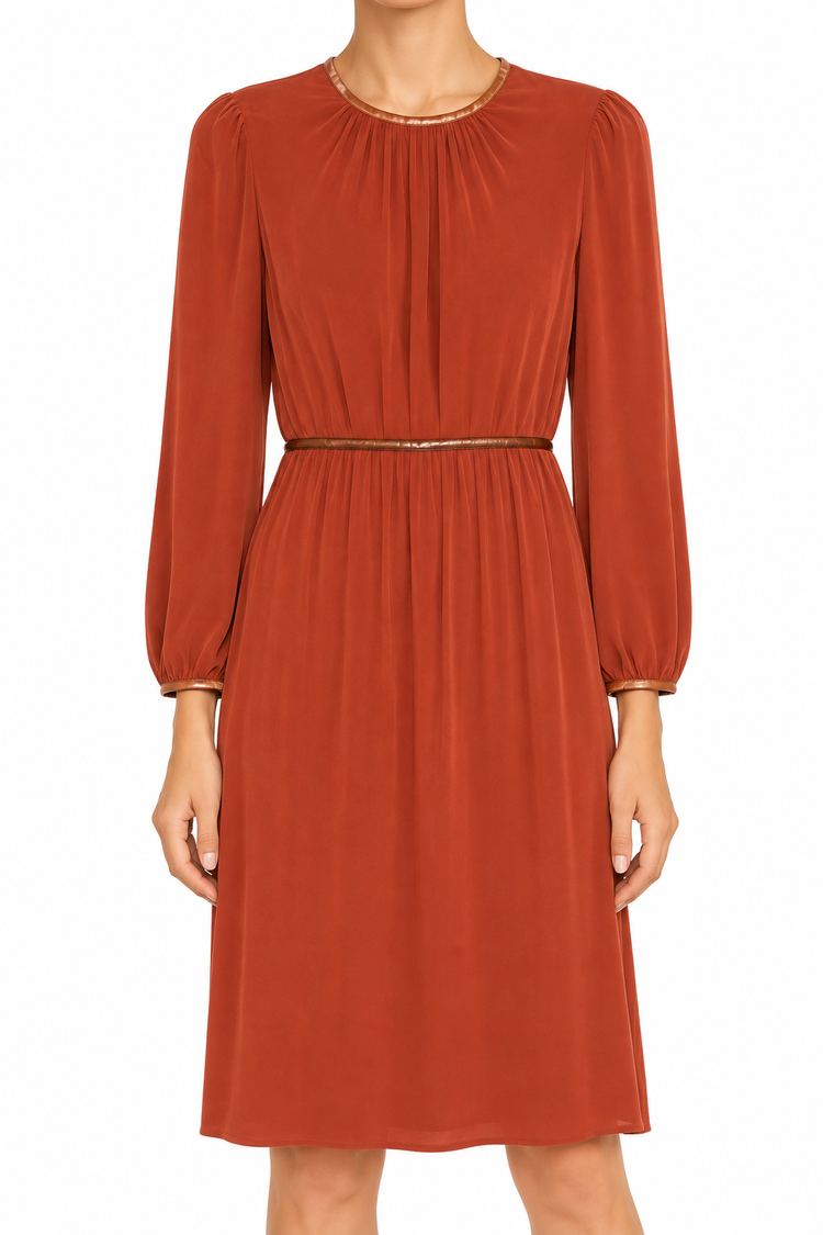 Prada terracotta long sleeve dress with a fitted waist and elegant design, displayed on a hanger against a neutral background.