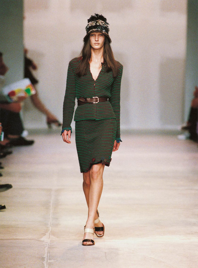 Prada Spring 2005 Look 13 green and red crochet cardigan coat with long sleeves, open-knit texture, front embellishment, longline silhouette and runway archive design.