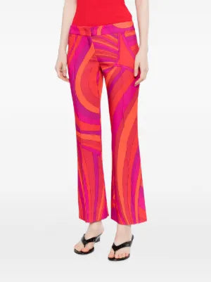 Pre-owned PUCCI printed cady straight-leg trousers shown on a model, featuring a vibrant pattern and tailored fit.