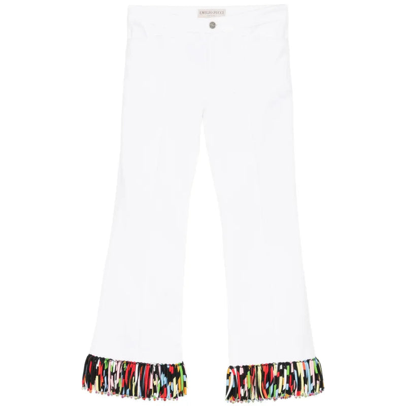 White fringed straight-leg jeans by Emilio Pucci featuring a classic trouser style with fringe details along the hem.