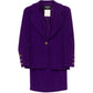 Purple Chanel single-breasted tweed suit set with blazer and matching tailored trousers, elegant and textured for sophisticated style.