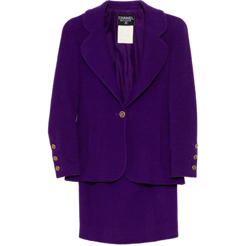 Purple Chanel single-breasted tweed suit set with blazer and matching tailored trousers, elegant and textured for sophisticated style.