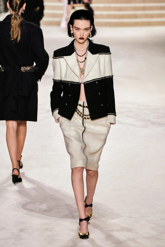 Chanel 2020 cream tweed skirt from pre-fall collection, stylish and textured, shown on a model with a classic design.