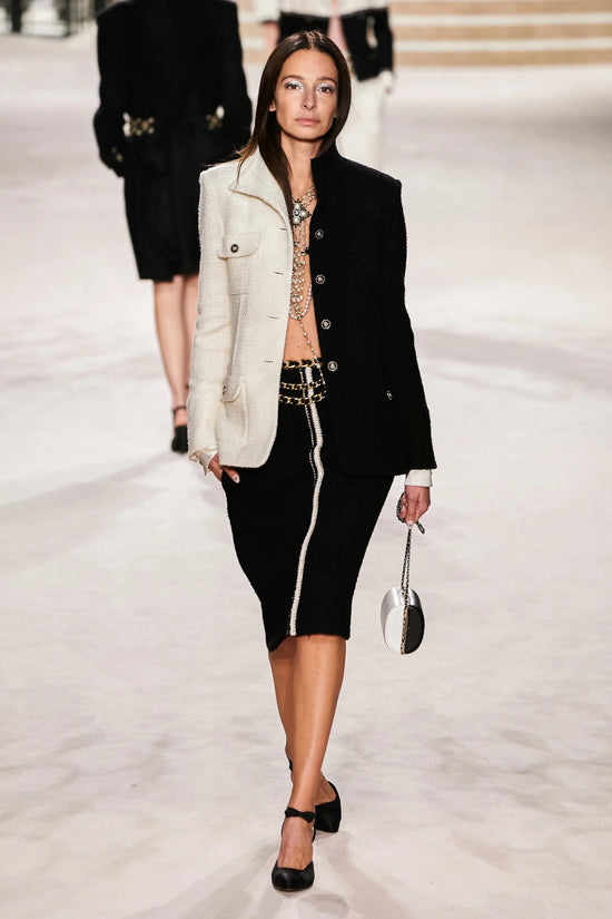 Chanel 2020 black tweed skirt from pre-fall ready-to-wear collection, stylish high-waisted design with textured fabric.