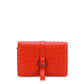 Red Bottega Veneta Intrecciato leather jewellery pouch, small accessory with woven design, soft leather exterior.