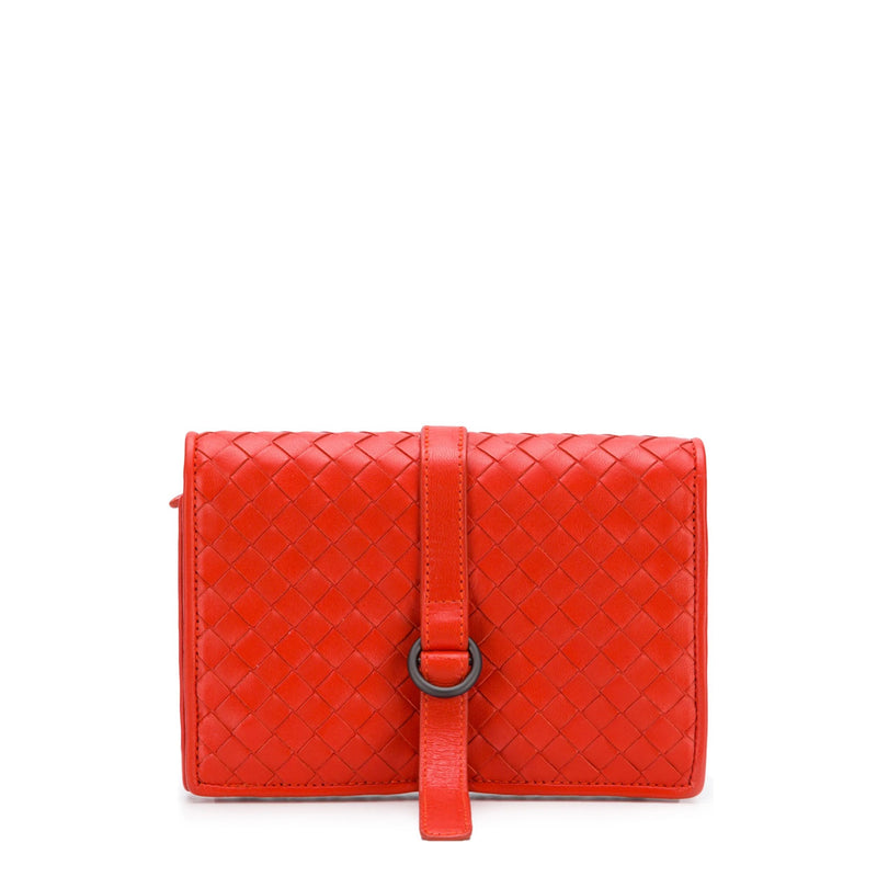 Red Bottega Veneta Intrecciato leather jewellery pouch, small accessory with woven design, soft leather exterior.