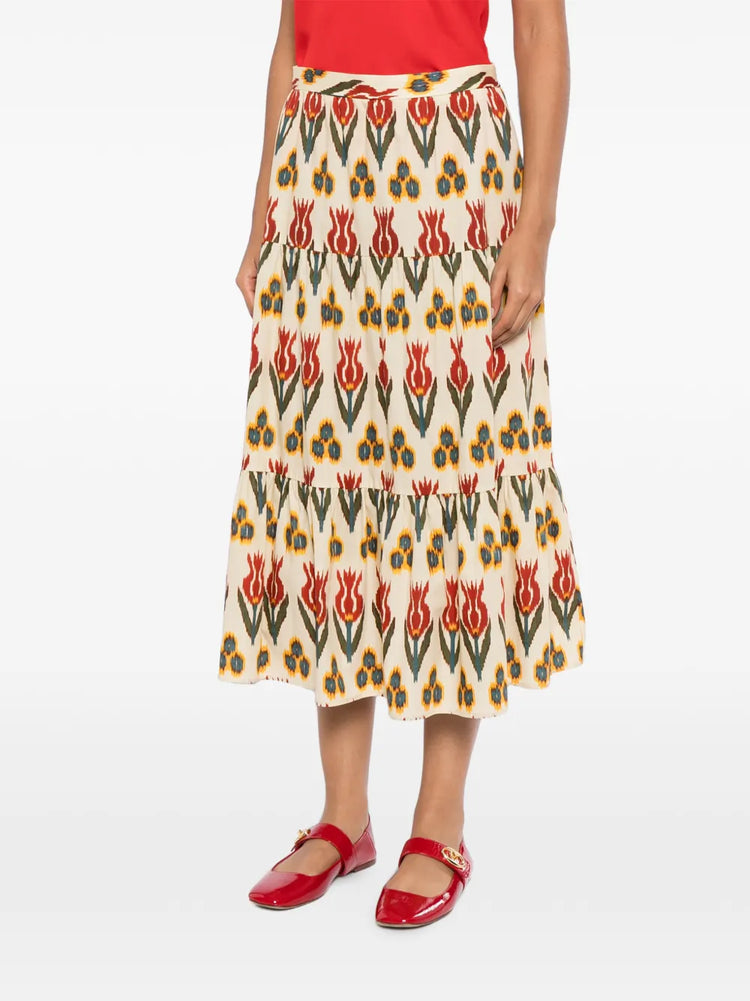 Red Valentino tiered printed skirt with a flowing design, featuring multiple layers and vibrant floral patterns.