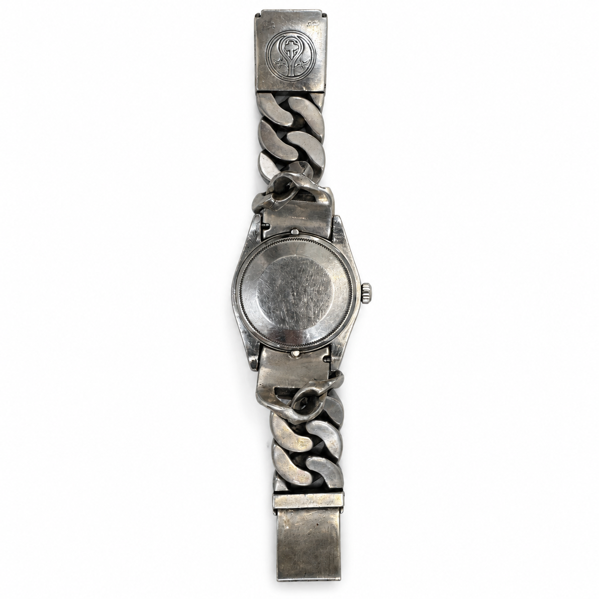 A Rolex x Loree Rodkin luxury watch silver-tone metal watch with a chunky Cuban link bracelet, shown from the back on a plain white background.