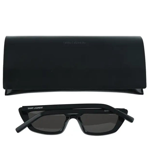 Black cat-eye sunglasses by Saint Laurent with dark tinted lenses and bold frames, stylish accessory for fashion-forward looks.