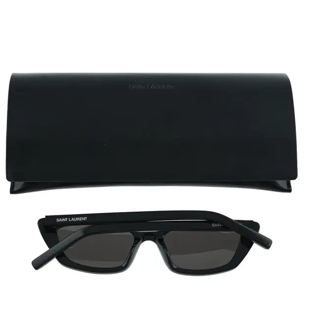 Black cat-eye sunglasses by Saint Laurent with dark tinted lenses and bold frames, stylish accessory for fashion-forward looks.