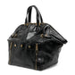 Black Saint Laurent Downtown patent leather tote bag with structured design and top handles, stylish and versatile for everyday use.