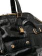 Black Saint Laurent Downtown patent leather tote bag with sleek design and structured silhouette.