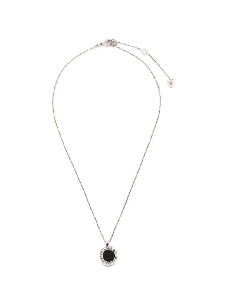 Bvlgari sterling silver Save the Children 10th Anniversary pendant necklace featuring a black onyx disc, a red ruby bail accent, and a Save the Children charm.
