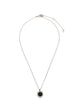 Bvlgari sterling silver Save the Children 10th Anniversary pendant necklace featuring a black onyx disc, a red ruby bail accent, and a Save the Children charm.