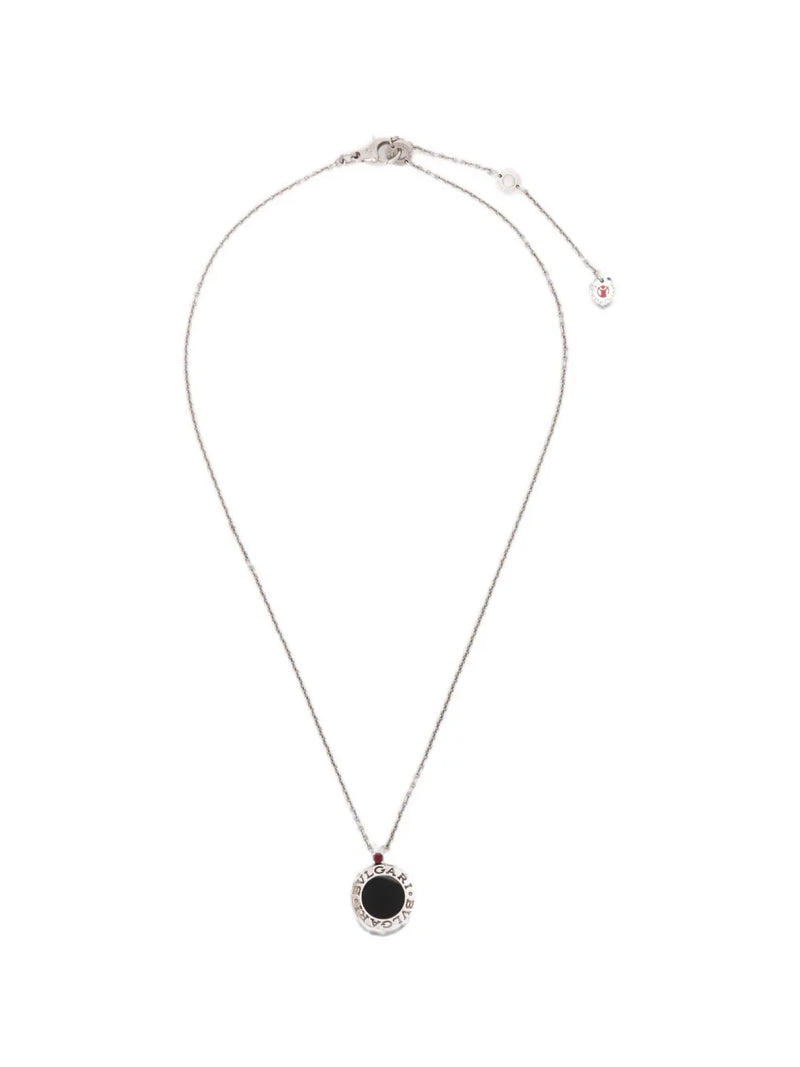 Bvlgari sterling silver Save the Children 10th Anniversary pendant necklace featuring a black onyx disc, a red ruby bail accent, and a Save the Children charm.