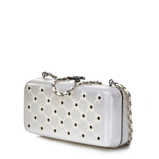 Silver crystal-encrusted Chanel clutch purse, elegant minaudiere with shimmering embellishments and sleek design.
