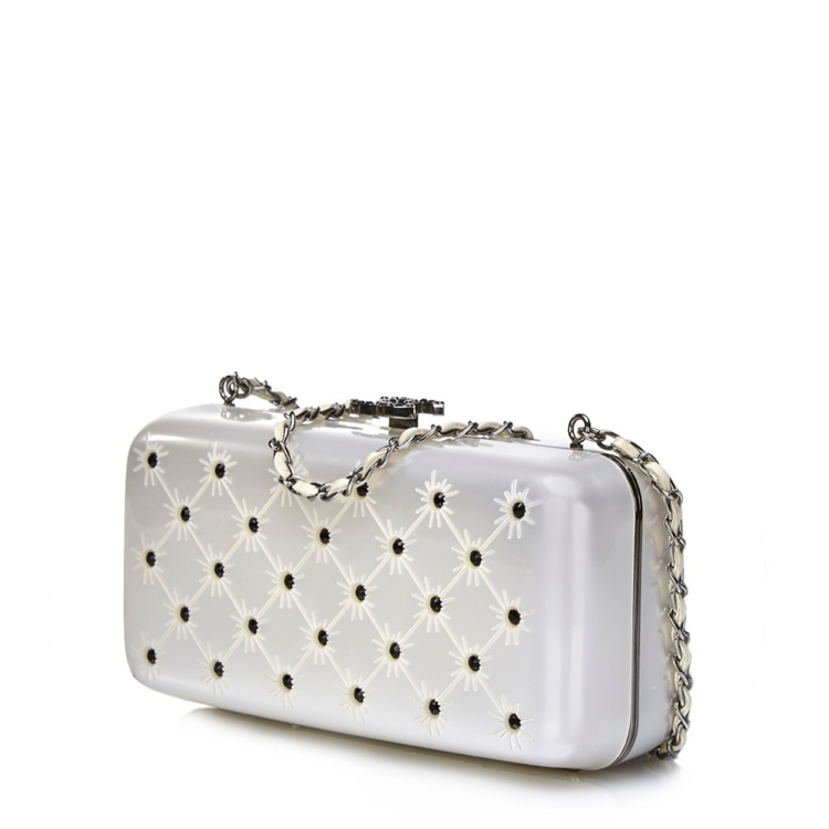 Silver crystal-encrusted Chanel clutch purse, elegant minaudiere with shimmering embellishments and sleek design.