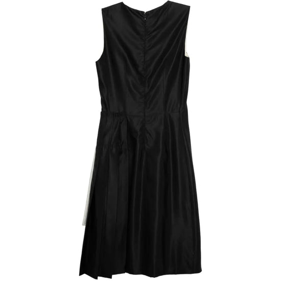 Prada sleeveless dress featuring a bow detail, elegant and stylish for formal or casual occasions.