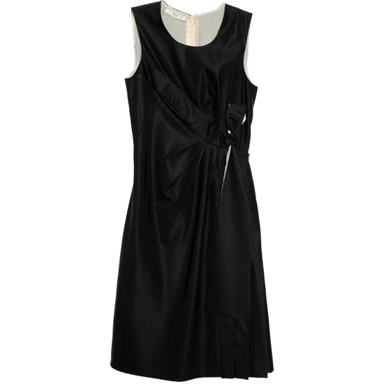 Prada sleeveless dress with a bow detail, shown from the front, featuring elegant fabric and stylish design.