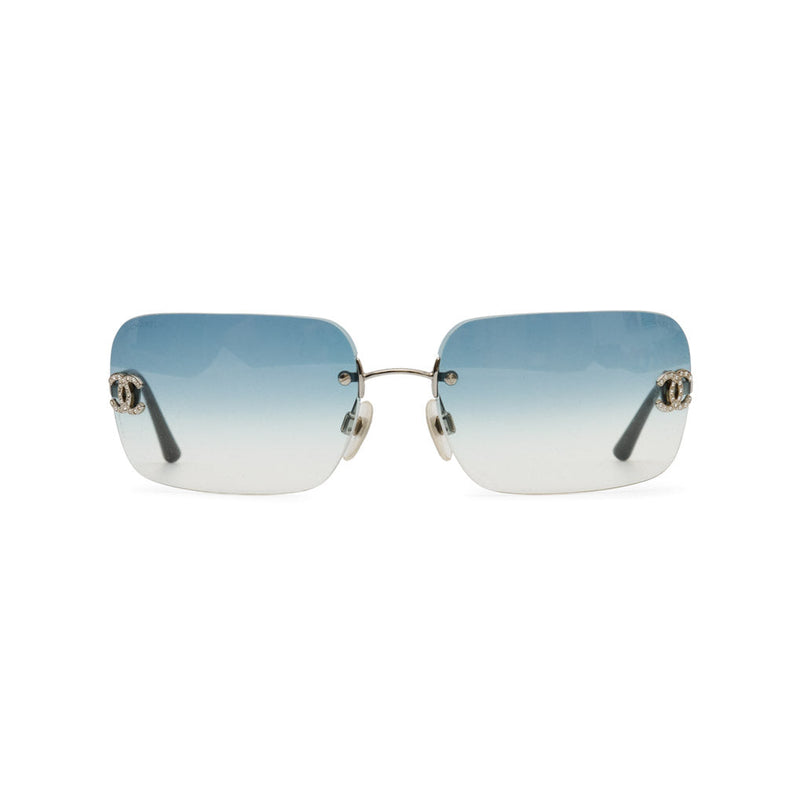 Rimless square sunglasses with a blue-to-white gradient lens and silver-tone metal hardware, shown against a plain white background.