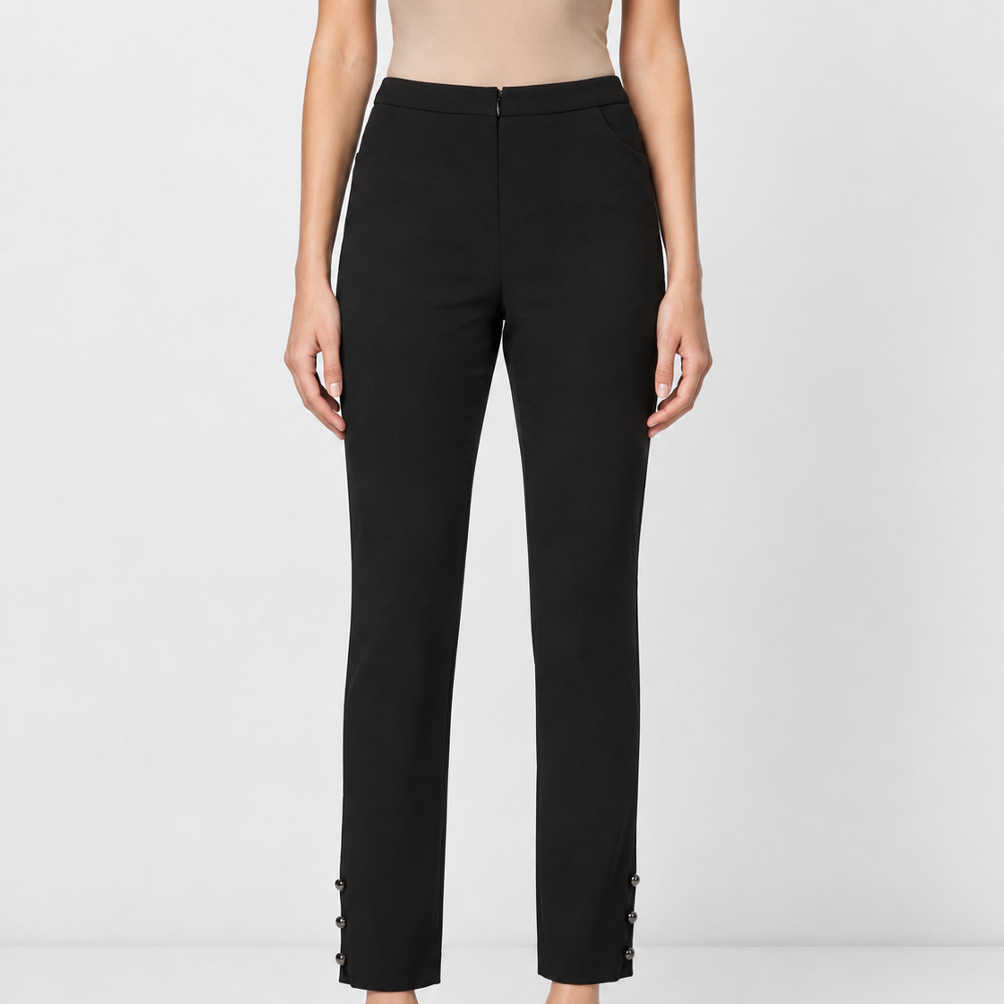 Chanel black silk trousers with tailored fit and ankle button details, featuring a sleek and elegant design.