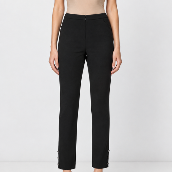 Chanel black silk trousers with tailored fit and ankle button details, featuring a sleek and elegant design.