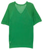 Hermès silk green top displayed on a model, showcasing elegant long sleeves and a smooth, luxurious fabric finish.
