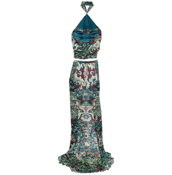 Saint Laurent two-piece evening dress set with elegant fabric and modern design, shown from a side view.