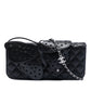 Chanel quilted lambskin butterfly clutch with chain strap for shoulder wear, featuring a textured quilted design and elegant craftsmanship.