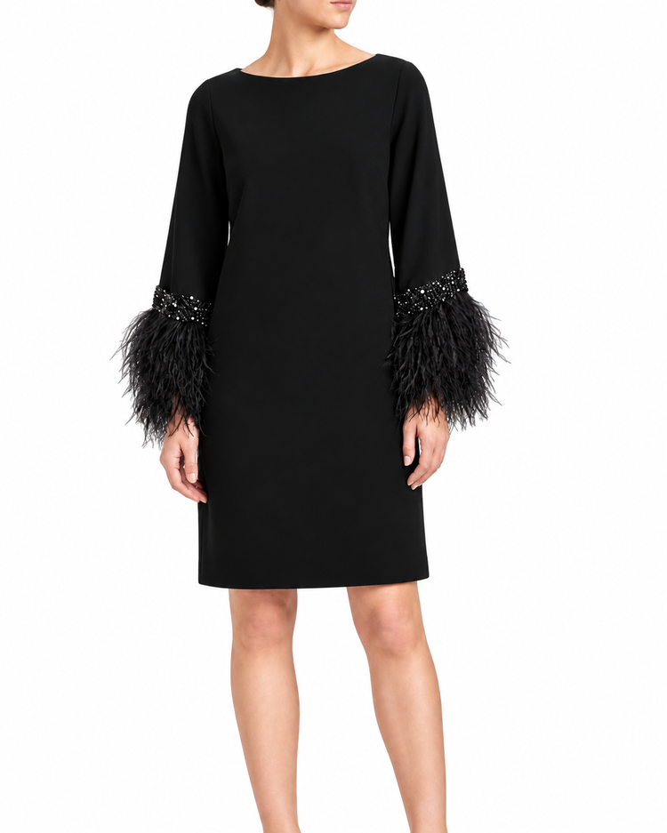 Valentino feather dress featuring delicate feather details, elegant design, and flowing fabric for a sophisticated look.