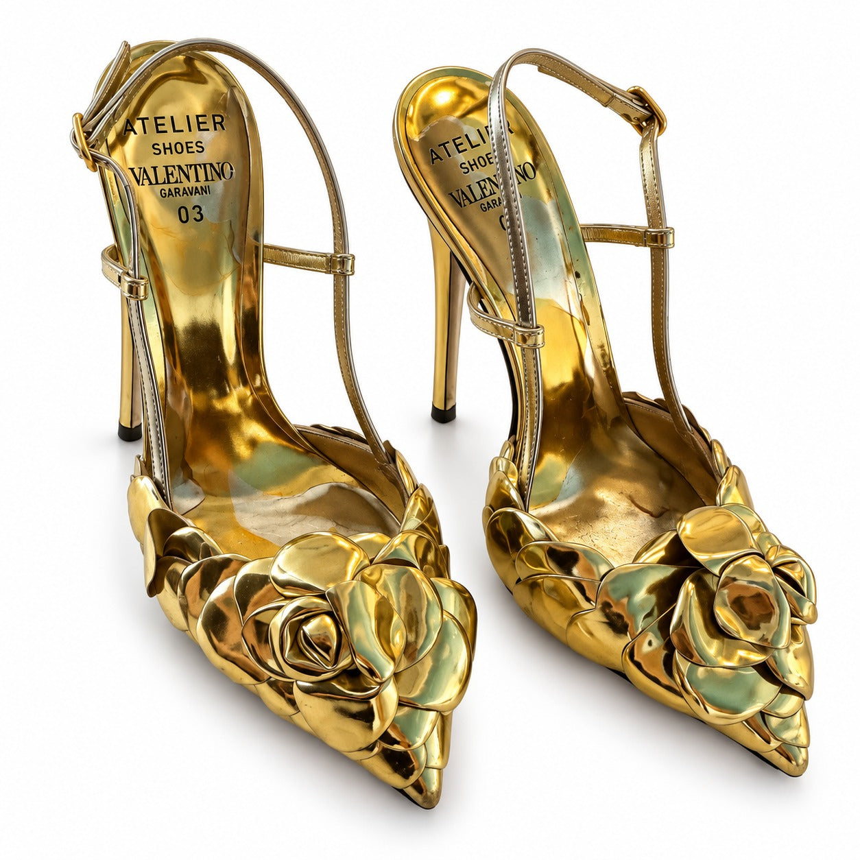 Valentino Atelier 03 Rose Edition metallic slingback pumps in gold with pointed toes and elegant design.
