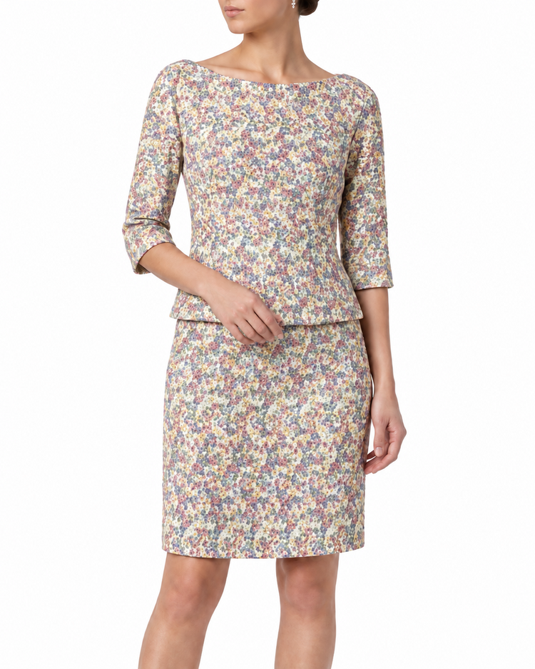 Versace pastel ditsy floral embroidered top and skirt set, featuring delicate floral embroidery on soft pastel fabric.