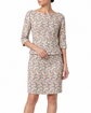 Versace pastel ditsy floral embroidered top and skirt set, featuring delicate floral embroidery on soft pastel fabric.