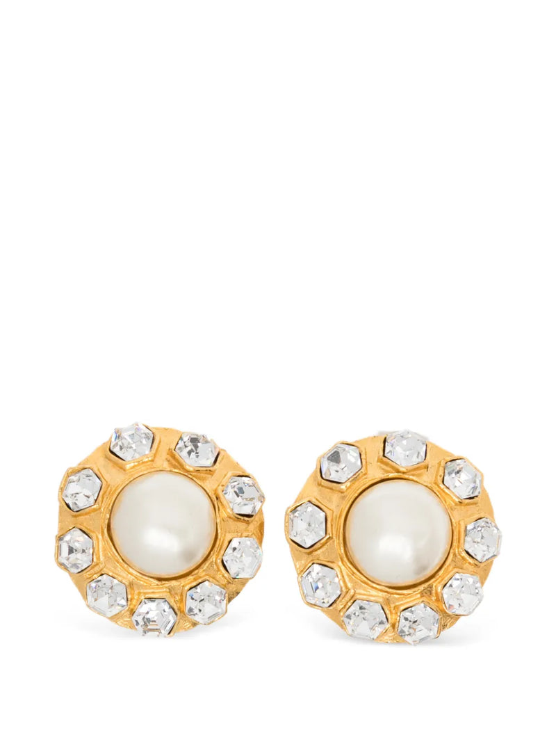 Pair of vintage 1970s Chanel gold-plated clip-on flower earrings featuring a central faux pearl cabochon surrounded by a halo of clear crystals.