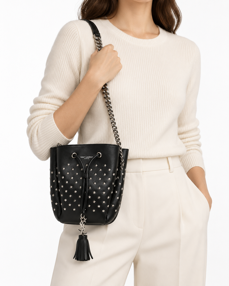 Yves Saint Laurent Small Emmanuelle Bucket Bag in leather, featuring shoulder strap and stylish design.
