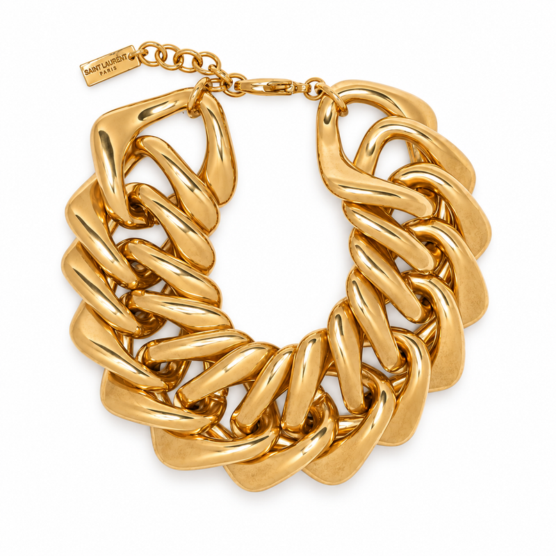 Yves Saint Laurent chunky gold-tone chain bracelet with oversized interlocking links, adjustable clasp, branded tag, 23 cm length and 3.2 cm width.